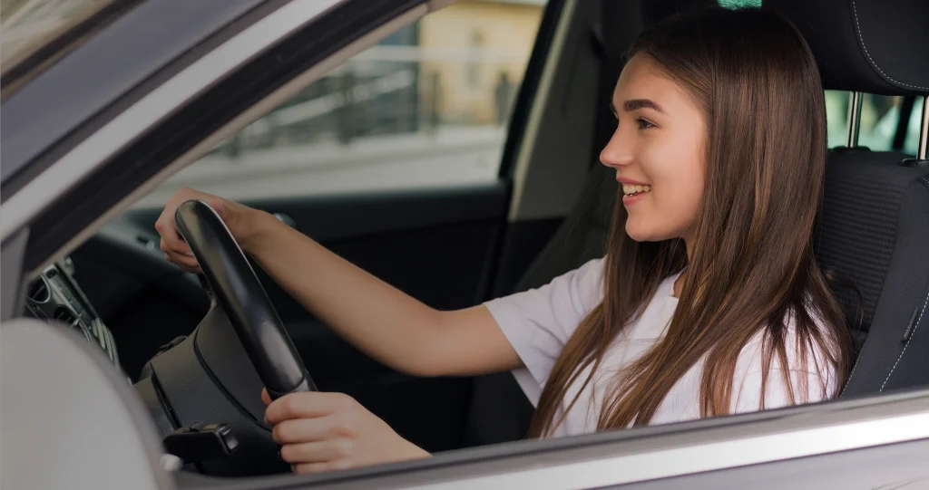 Woman driving car portrait image